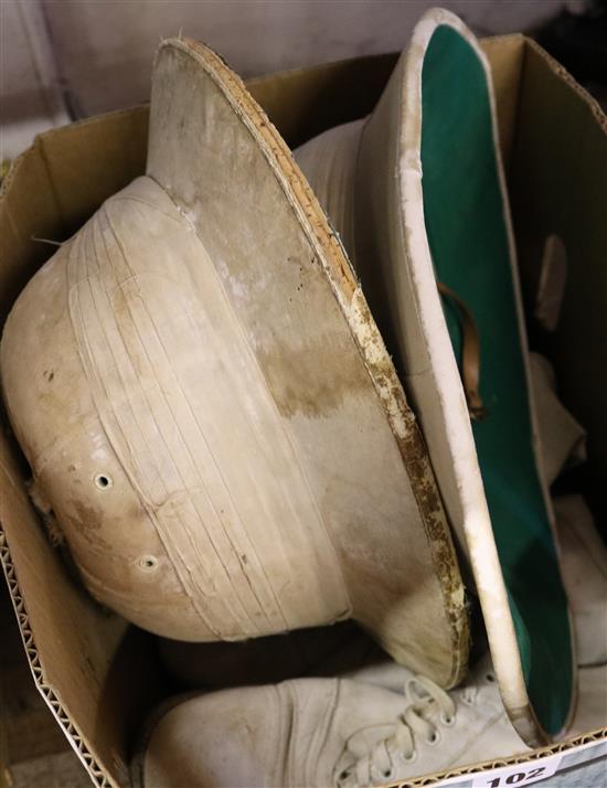 Cricket shoes & pith helmets